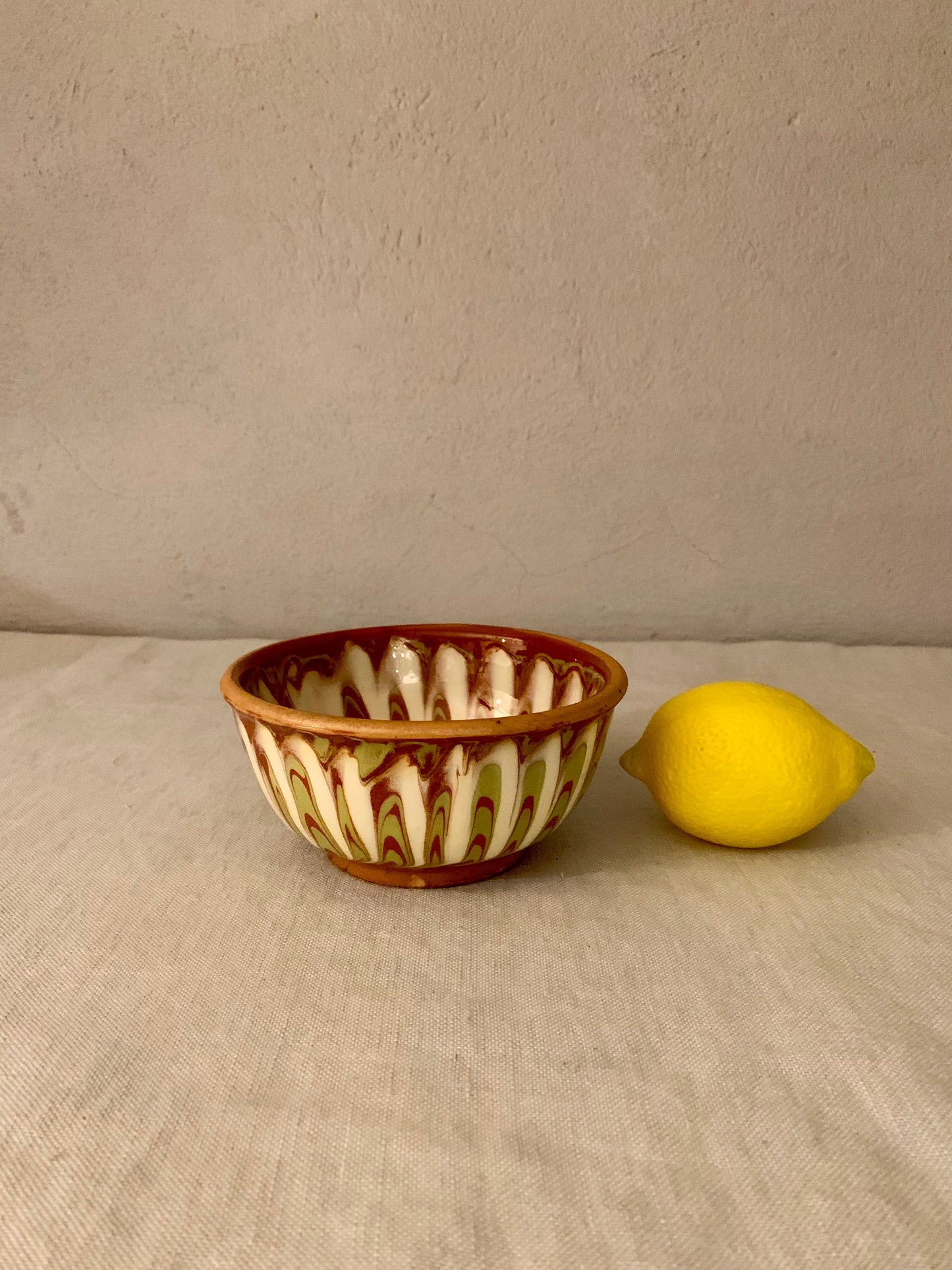 Vintage clay bowl with beautiful running glaze.