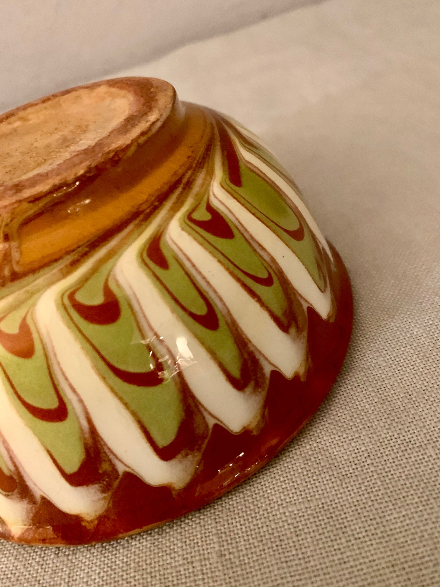 Vintage clay bowl with beautiful running glaze.