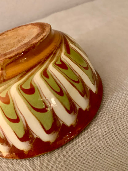 Vintage clay bowl with beautiful running glaze.
