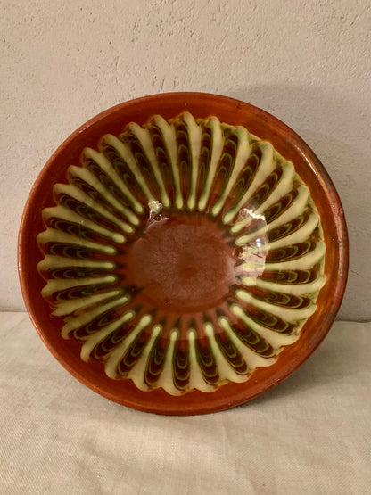 Vintage clay bowl with beautiful running glaze.