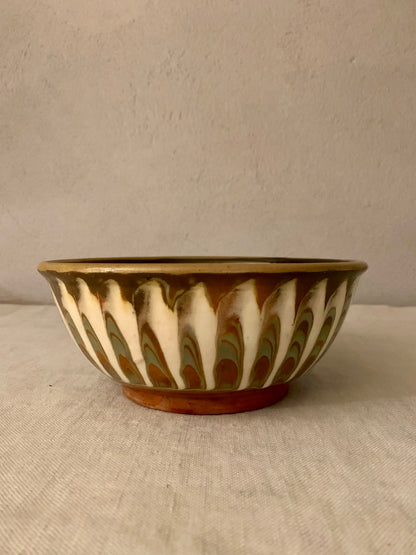Vintage clay bowl with beautiful running glaze.